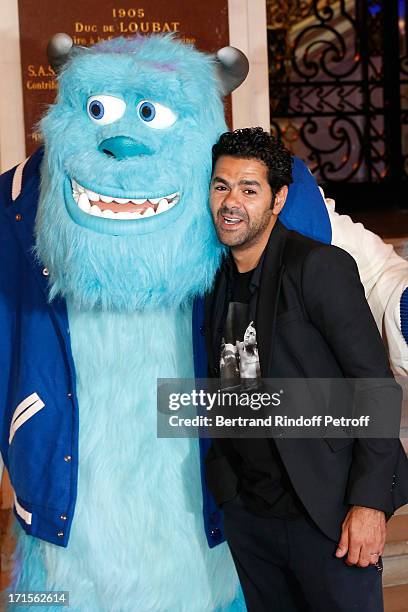 Humorist Jamel Debbouze poses at 'Monsters University' Paris movie premiere, held at La Sorbonne on June 26, 2013 in Paris, France.