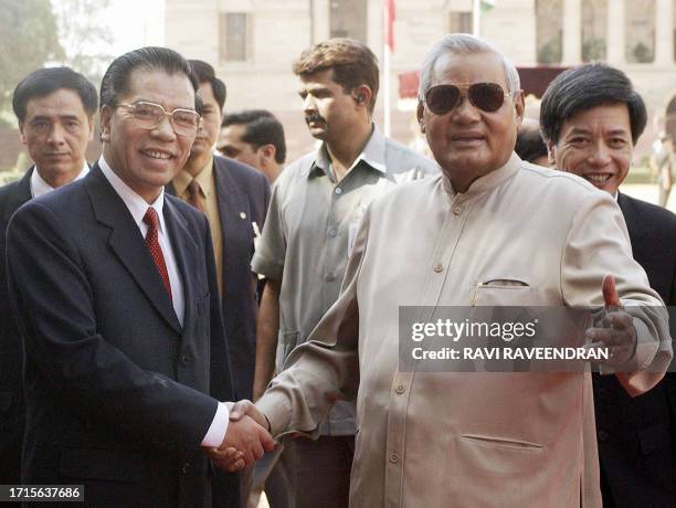 Indian Prime Minister Atal Behari Vajpayee greets Vietnam's Communist Party General Secretary, Nong Duc Manh, at a official welcome ceremony at the...