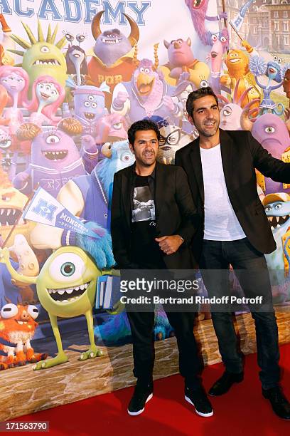 Humorists Jamel Debbouze and Ary Abittan pose at 'Monsters University' Paris movie premiere, held at La Sorbonne on June 26, 2013 in Paris, France.