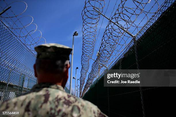 Razor wire is seen on the fence around Camp Delta which is part of the U.S. Military prison for 'enemy combatants' on June 26, 2013 in Guantanamo...