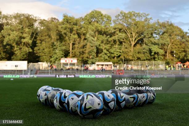 Footballs lie on the pitch prior to the 3. Liga match between Viktoria Köln and FC Ingolstadt 04 at Sportpark Hoehenberg on October 03, 2023 in...