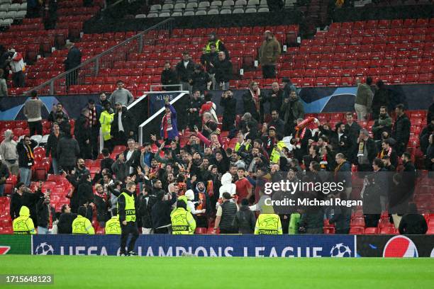 Galatasaray S.k fans celebrate in the home end following the team's victory during the UEFA Champions League match between Manchester United and...