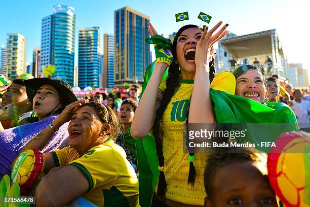 Brazilian fans watch the Confederations Cup Semi Final on June 26, 2013 at the FIFA Fan Fest, Fortaleza, Brazil.