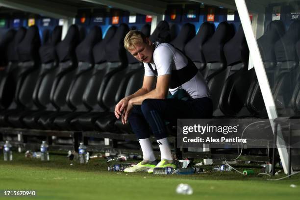 Aaron Ramsdale of Arsenal sits on the bench after the full-time whistle during the UEFA Champions League match between RC Lens and Arsenal FC at...