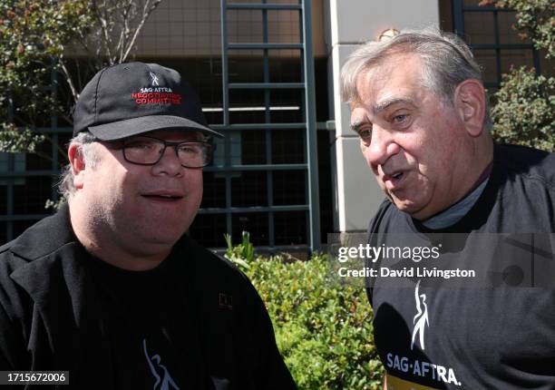 Sean Astin and Dan Lauria join the picket line outside Warner Bros. Studios on October 03, 2023 in Burbank, California. The WGA has reached a deal...