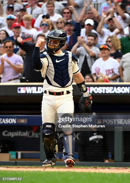 Ryan Jeffers of the Minnesota Twins celebrates after tagging out Bo Bichette of the Toronto Blue Jays at home plate during the fourth inning in Game...