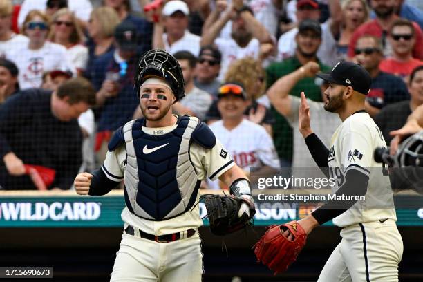 Ryan Jeffers of the Minnesota Twins celebrates with Pablo Lopez after tagging out Bo Bichette of the Toronto Blue Jays during the fourth inning in...