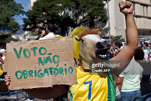 Anti-government protesters demonstrate in Belo Horizonte, on June 26, 2013 before the start of the semifinal match of the FIFA Confederations Cup...