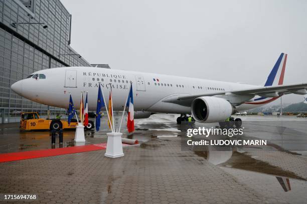 The Airbus A330 aircraft of French President Macron arrives at the Airbus plant in Hamburg, northern Germany, on October 9 the first day of two-day...