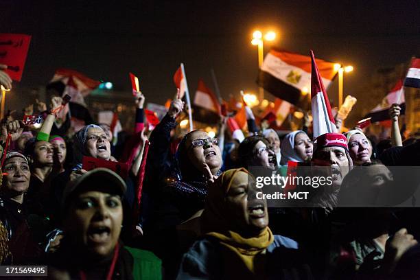 Large group of women take to the front of a gathering of opposition supporters in Cairo, Egypt's Tahrir Square while waiting for President Mohammed...