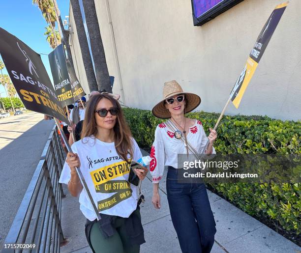 Lesley-Ann Brandt and Perrey Reeves join the picket line outside Warner Bros. Studios on October 03, 2023 in Burbank, California. The WGA has reached...