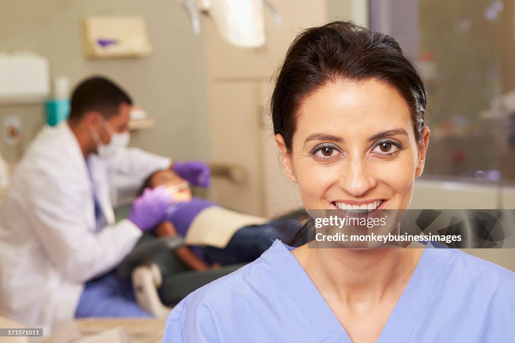 A focused shot of a dental hygienist