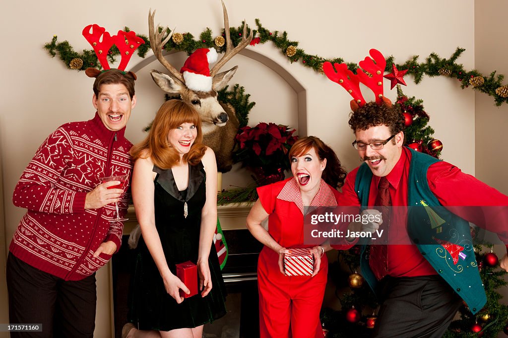 People in festive clothing smiling during a holiday party