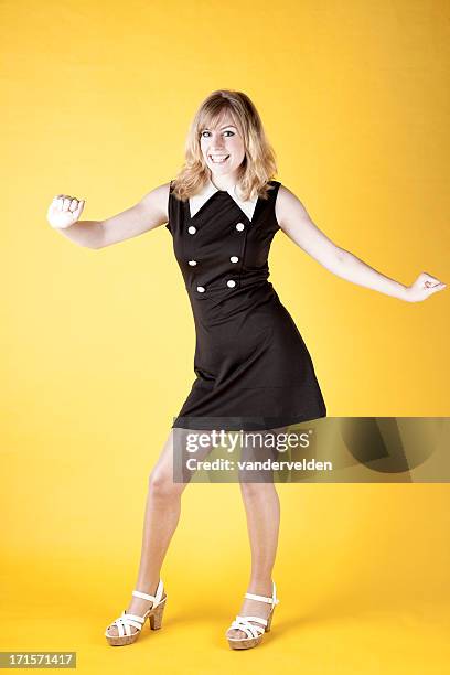retro-colored photo of a 1960s dancer twisting - the twist stock pictures, royalty-free photos & images