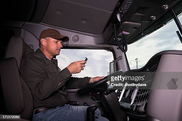 texting and trucking - frustrated workman stock pictures, royalty-free photos & images