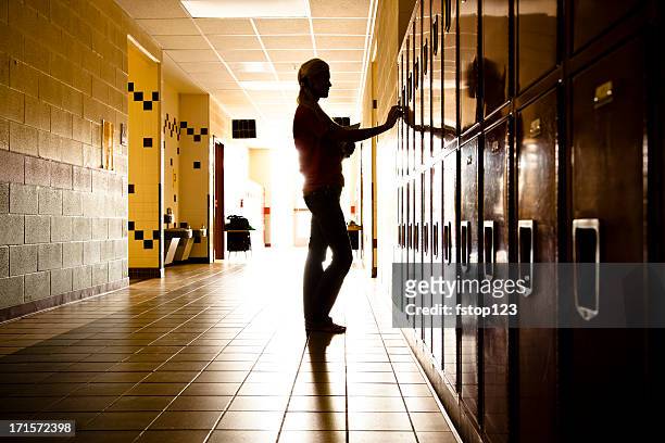 silhouette of student in hallway. lockers. high school. girl. education. - school building silhouette stock pictures, royalty-free photos & images