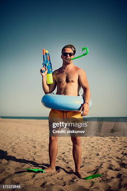 young bizzare man with toys - summer comedies party stockfoto's en -beelden