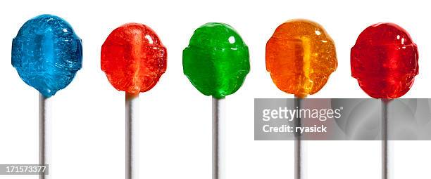 row of five multicolored hard candy lollipops isolated on white - lolly stockfoto's en -beelden