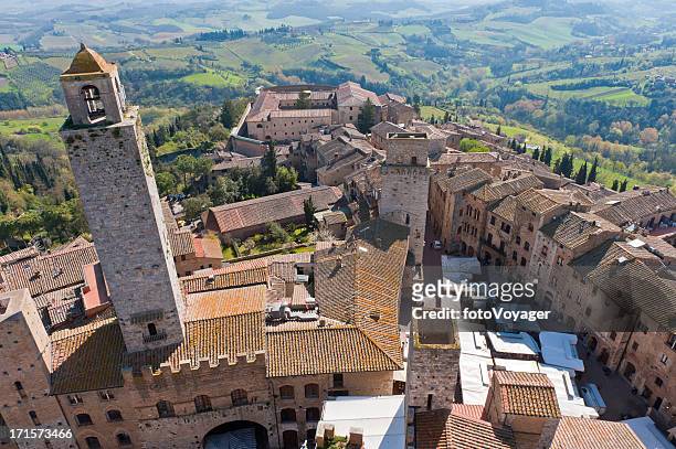 tuscany aerial view over hilltop town towers san gimignano italy - san gimignano stock pictures, royalty-free photos & images