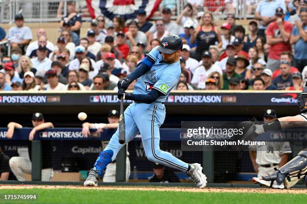 Kevin Kiermaier of the Toronto Blue Jays hits an RBI single to score Bo Bichette against the Minnesota Twins during the sixth inning in Game One of...
