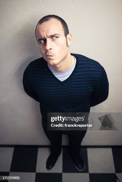 serious curious man - male feet on face stock pictures, royalty-free photos & images