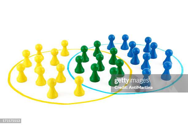 teams of board game pieces - community figures stock pictures, royalty-free photos & images