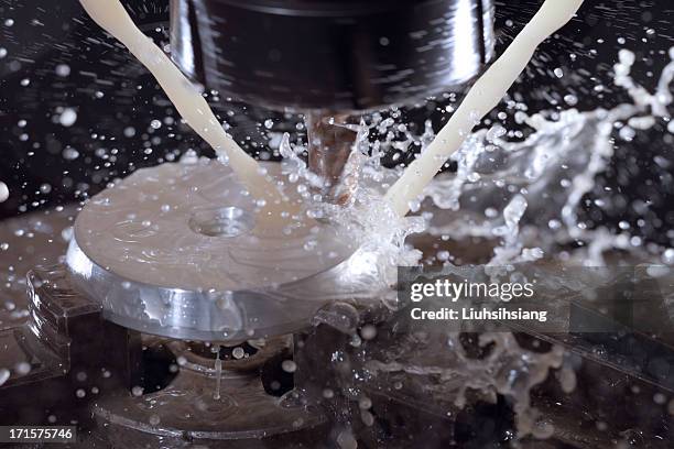 milling machine in operation(blurred motion). - coolant stock pictures, royalty-free photos & images