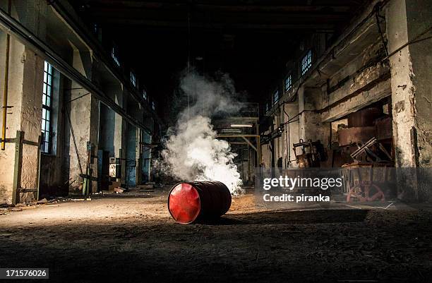 smoky barrel in einer alten fabrik geht - abandoned factory stock-fotos und bilder