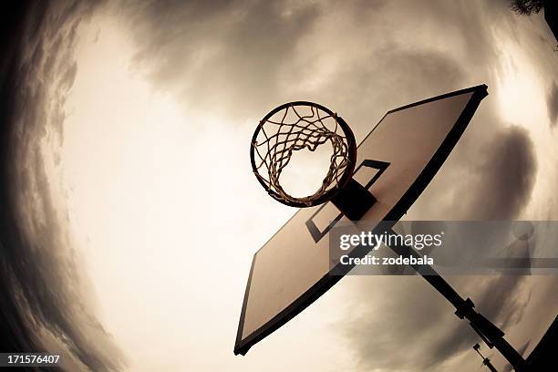 basketball hoop, dramatic sky - old basketball hoop stock pictures, royalty-free photos & images