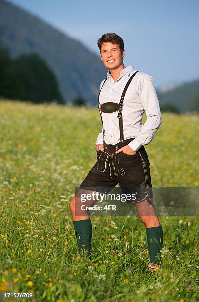handsome man wearing lederhosen, austrian alps (xxxl) - lederhosen stock pictures, royalty-free photos & images