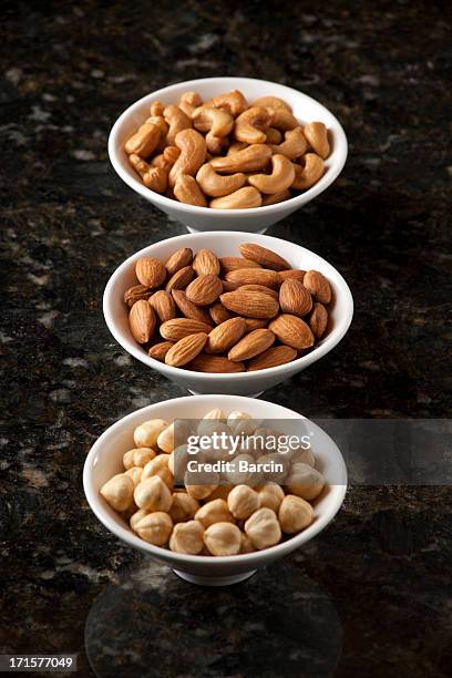 almond nuts, cashews and hazelnuts - dry fruits in bowl stock pictures, royalty-free photos & images