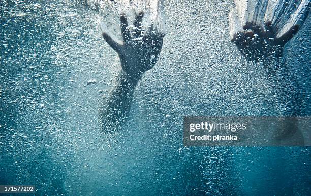 hands underwater - woman underwater stock pictures, royalty-free photos & images