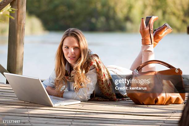woman and laptop - kentarus stock pictures, royalty-free photos & images