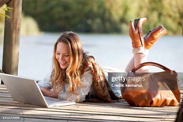 woman and laptop - kentarus stock pictures, royalty-free photos & images