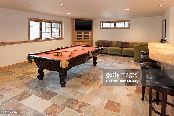billiards room in finished basement - basement stock pictures, royalty-free photos & images