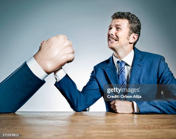 businessmen arm wrestling - big moustache stock pictures, royalty-free photos & images
