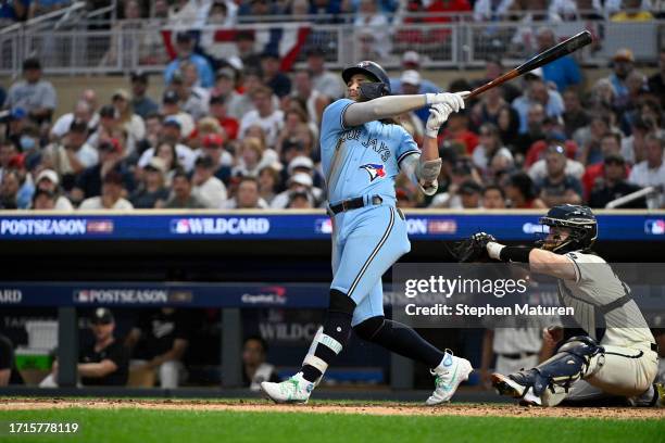 Bo Bichette of the Toronto Blue Jays strikes out against the Minnesota Twins during the eighth inning in Game One of the Wild Card Series at Target...