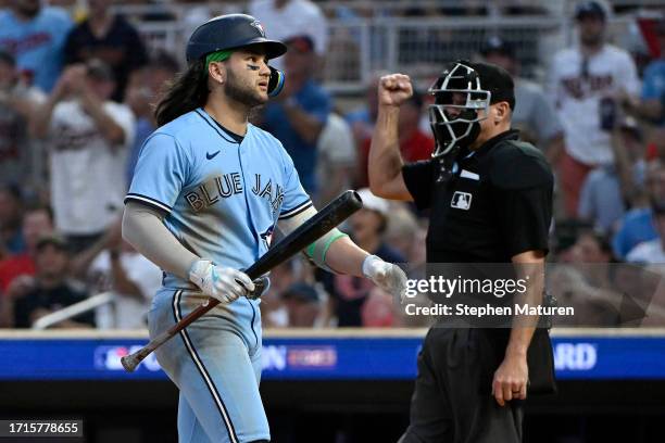 Bo Bichette of the Toronto Blue Jays reacts after striking out against the Minnesota Twins during the eighth inning in Game One of the Wild Card...