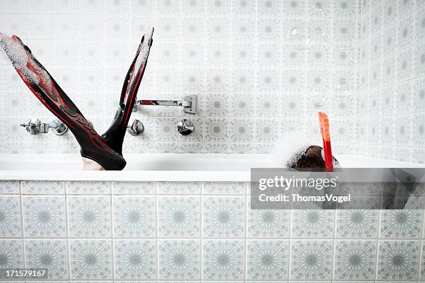 bathtub snorkeling - red tub stock pictures, royalty-free photos & images