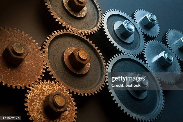 improving economy - rusty gears stock pictures, royalty-free photos & images