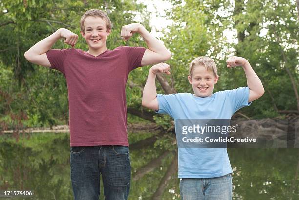 brothers having fun - lang fysieke beschrijving stockfoto's en -beelden