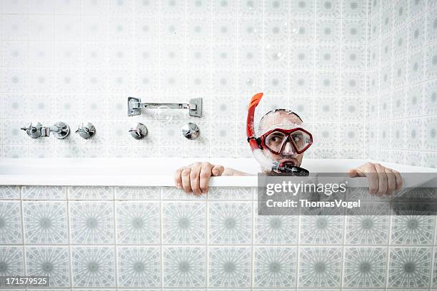 bathtub snorkeling - red tub stock pictures, royalty-free photos & images