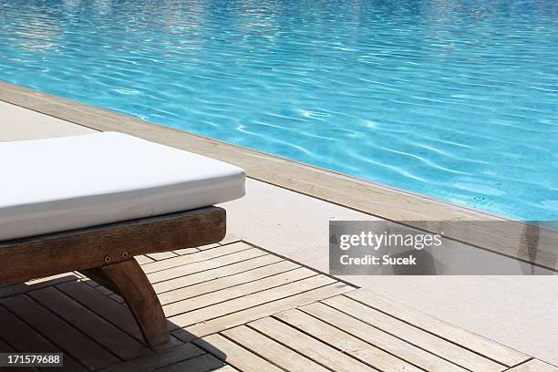 tanning beds in resort - poolside stock pictures, royalty-free photos & images