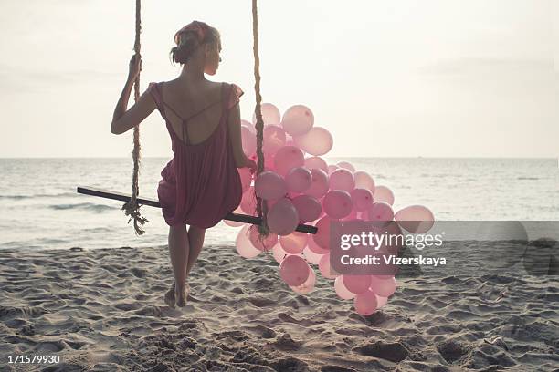 beautiful women at swing with pink ballons - swing bildbanksfoton och bilder