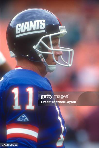 Phil Simms of the New York Giants looks on before a NFL football game against the Washington Redskins on October 10, 1993 at RFK Stadium in...