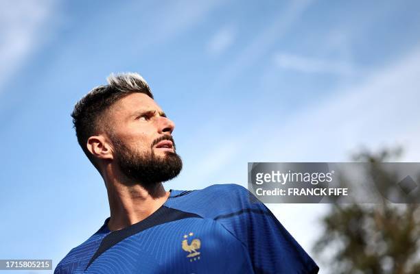France's forward Olivier Giroud arrives for a training session in Clairefontaine-en-Yvelines on October 9 as part of the team's preparation for the...