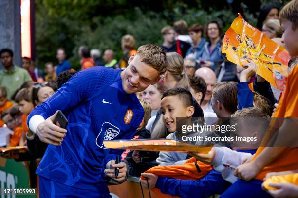 Supporters of Holland making a selfie with Bart Verbruggen of Holland during the Training MenTraining Holland at the KNVB Campus on October 9, 2023...