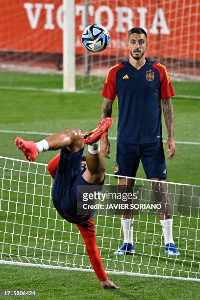 Spain's forward Alvaro Morata and Spain's forward Joselu attend a Spanish team's training session ahead of the EURO 2024 qualifying football match...
