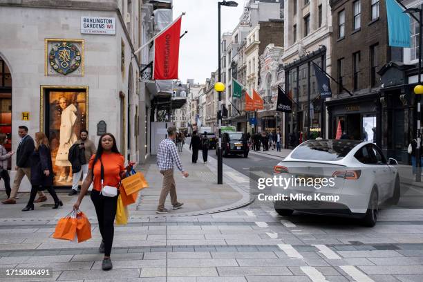 Woman with shopping bags on Bond Street on 27th September 2023 in London, United Kingdom. Bond Street is one of the principal streets in the West End...
