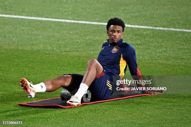 Spain's defender Alejandro Balde attends a Spanish team's training session ahead of the EURO 2024 qualifying football match between Spain and...